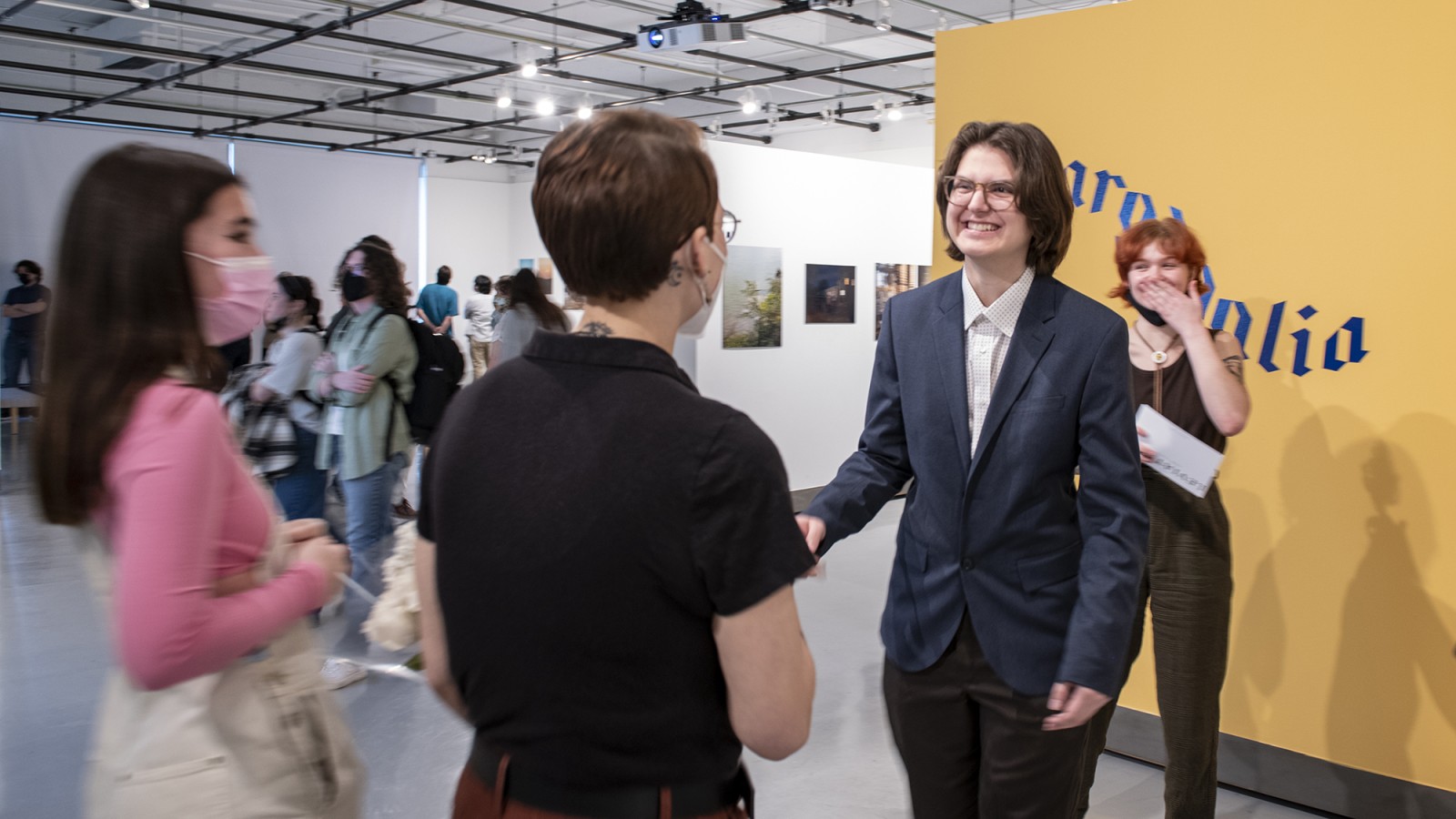 People talking in a gallery.