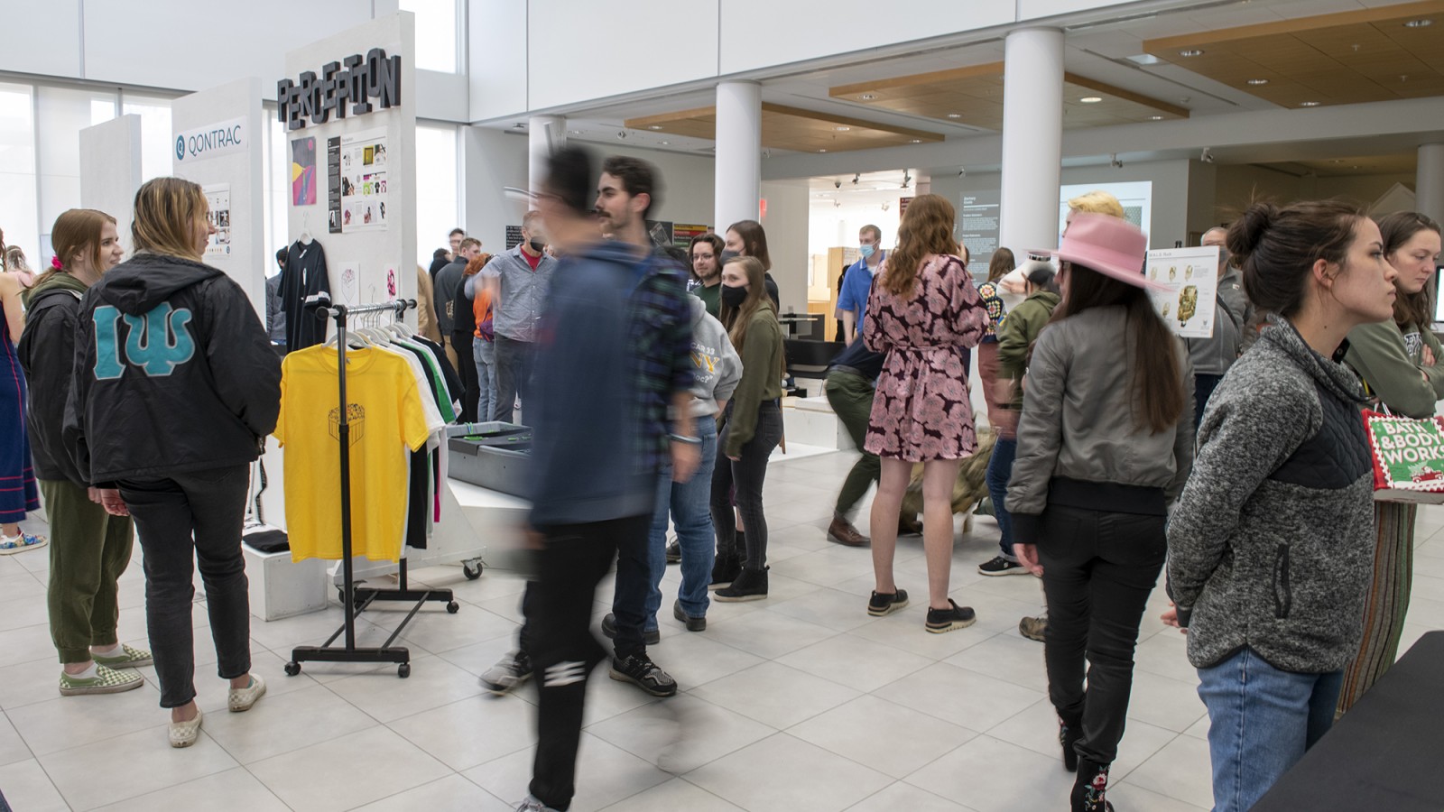 People pack into University Gallery for the industrial design BFA capstone exhibition.