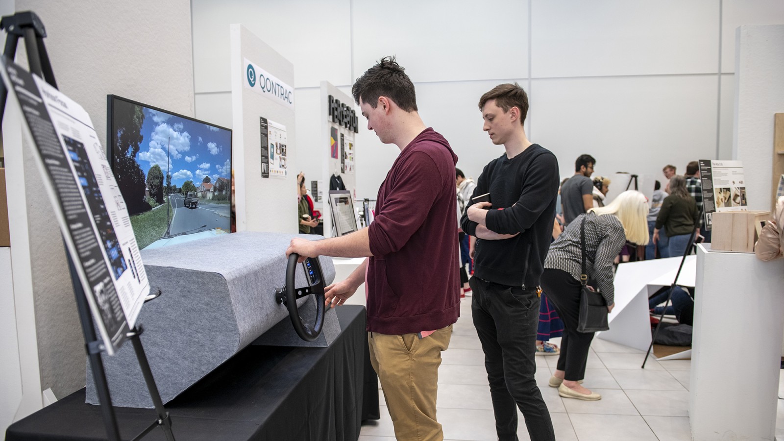 Students operate an interactive exhibit.