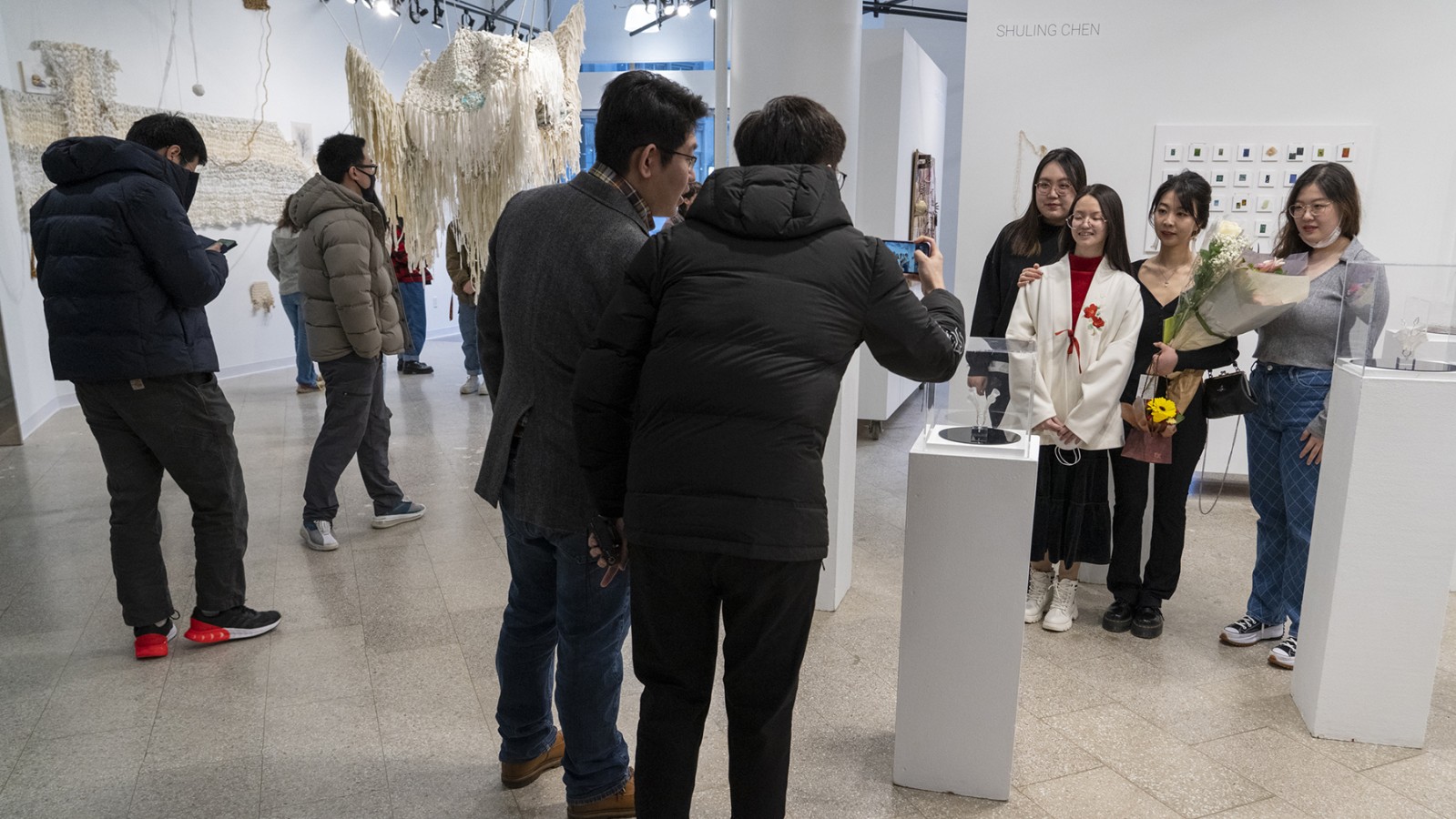Students pose for a photo in RIT City Art Space.