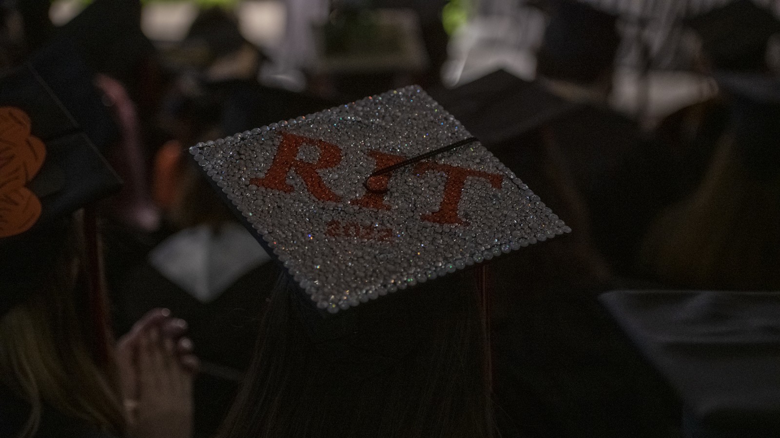 A grad cap that reads RIT.