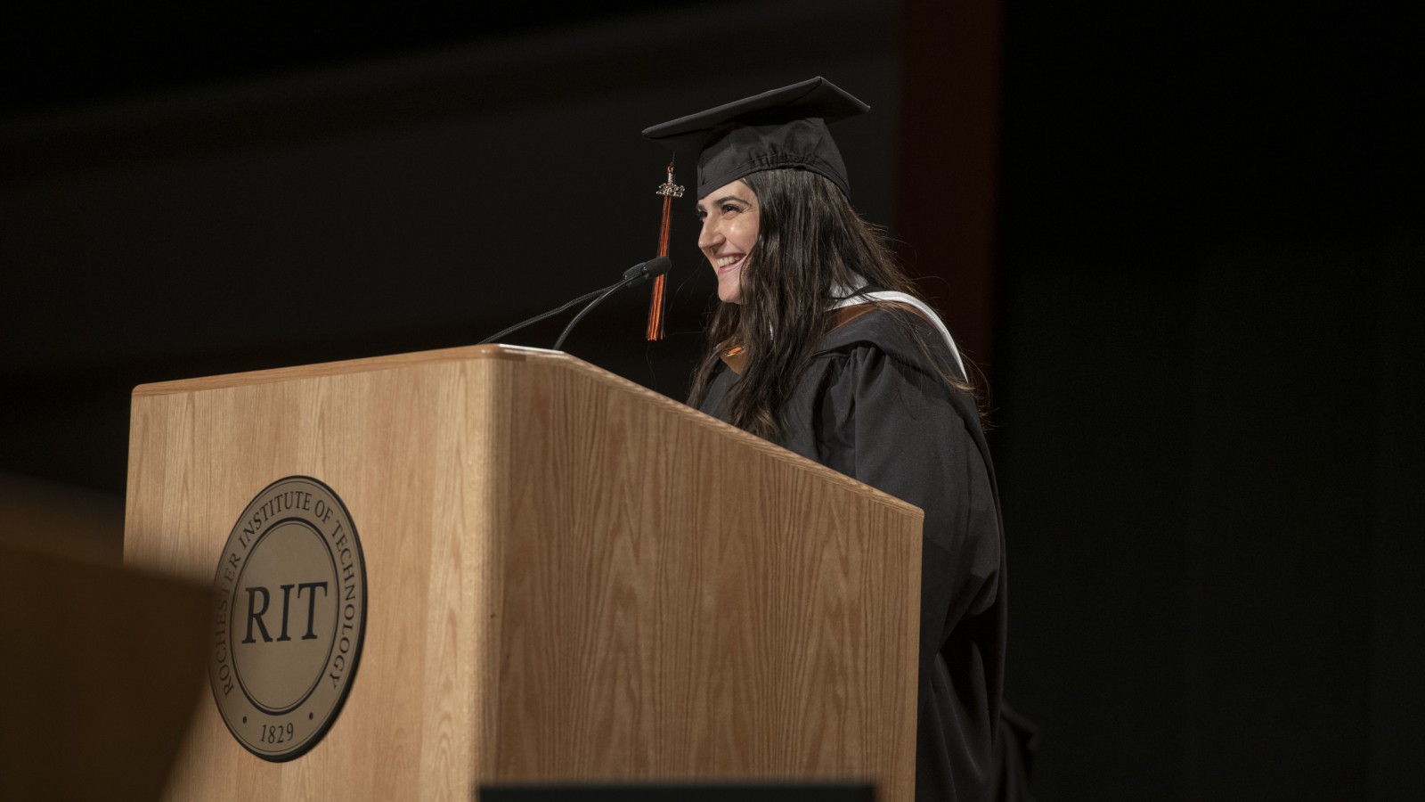 Graduate delegate Selma Pena at the lectern.