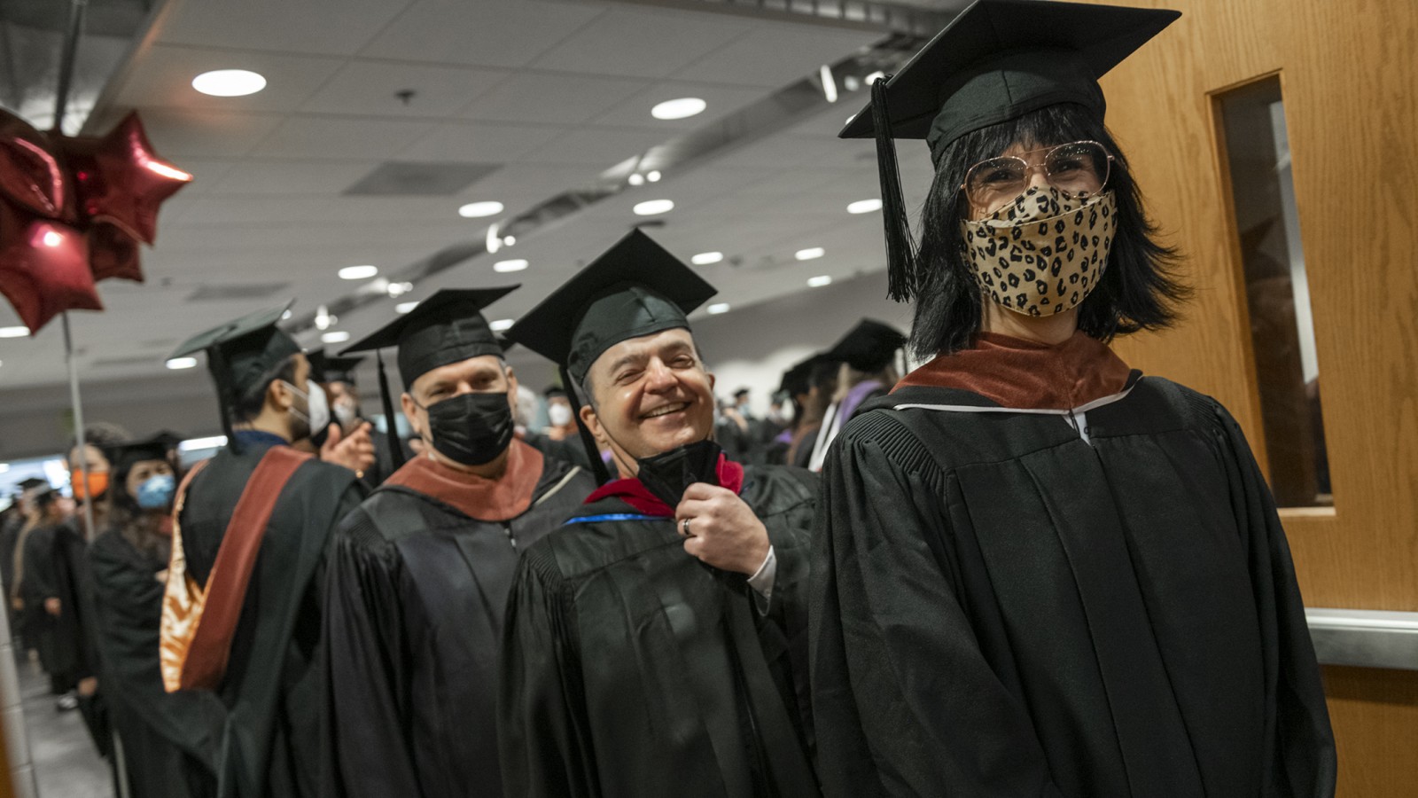 Film and animation faculty stand in a line.