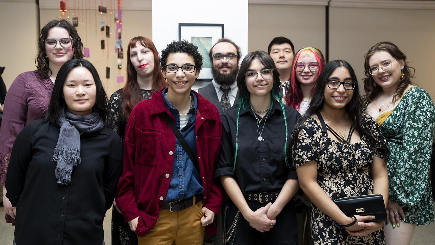 A group of fine art photography seniors pose together in William Harris Gallery
