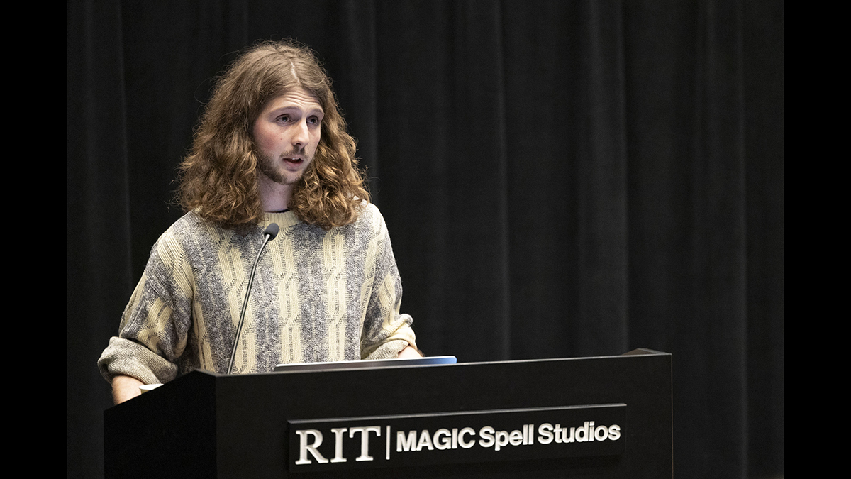 A student speaks at a podium.
