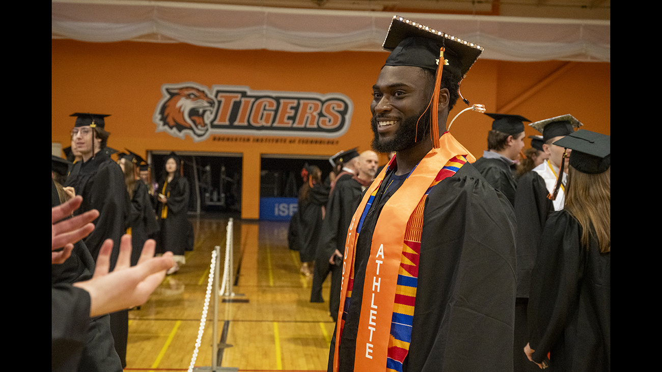 A student with a graduation cap with lights.