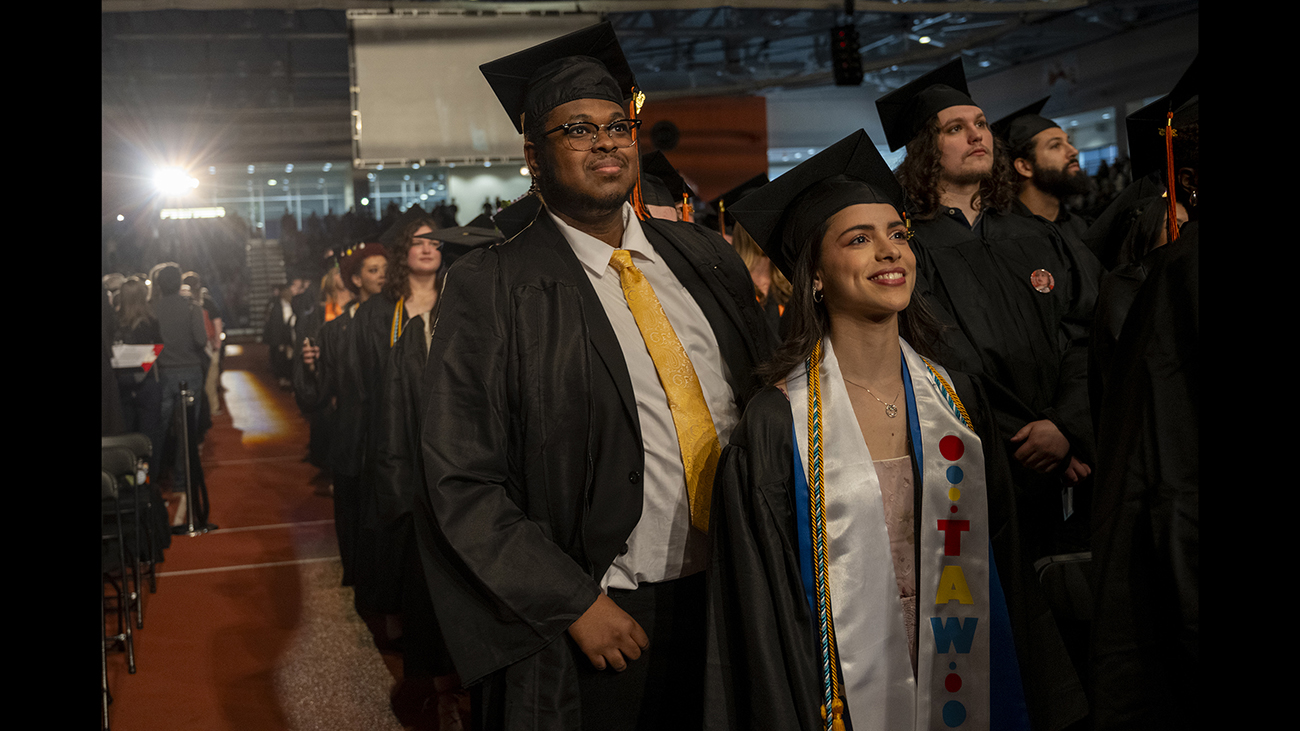 Students during commencement wearing regalia.