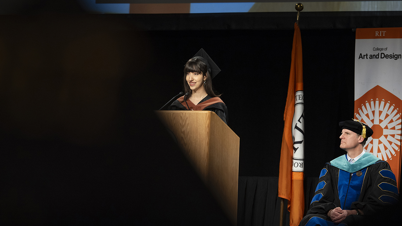 CAD's graduate delegate speaks during commencement.