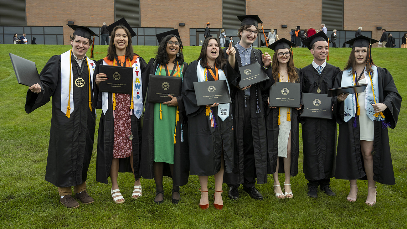 A group of celebrating students outside the field house.
