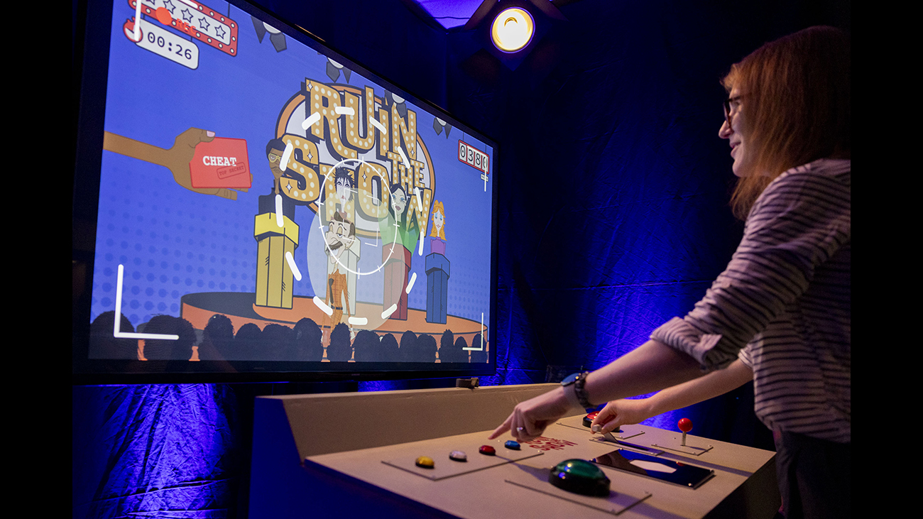 A user plays a digital experience made by RIT students.