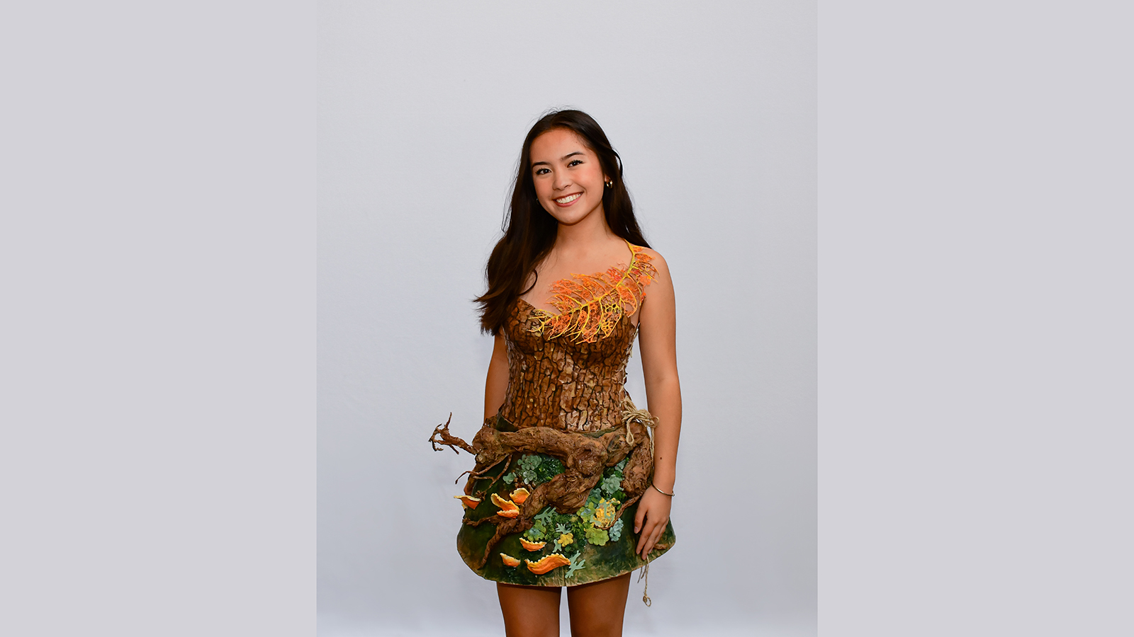A jungle/nature-themed dress handmade by a student for the Charrette.