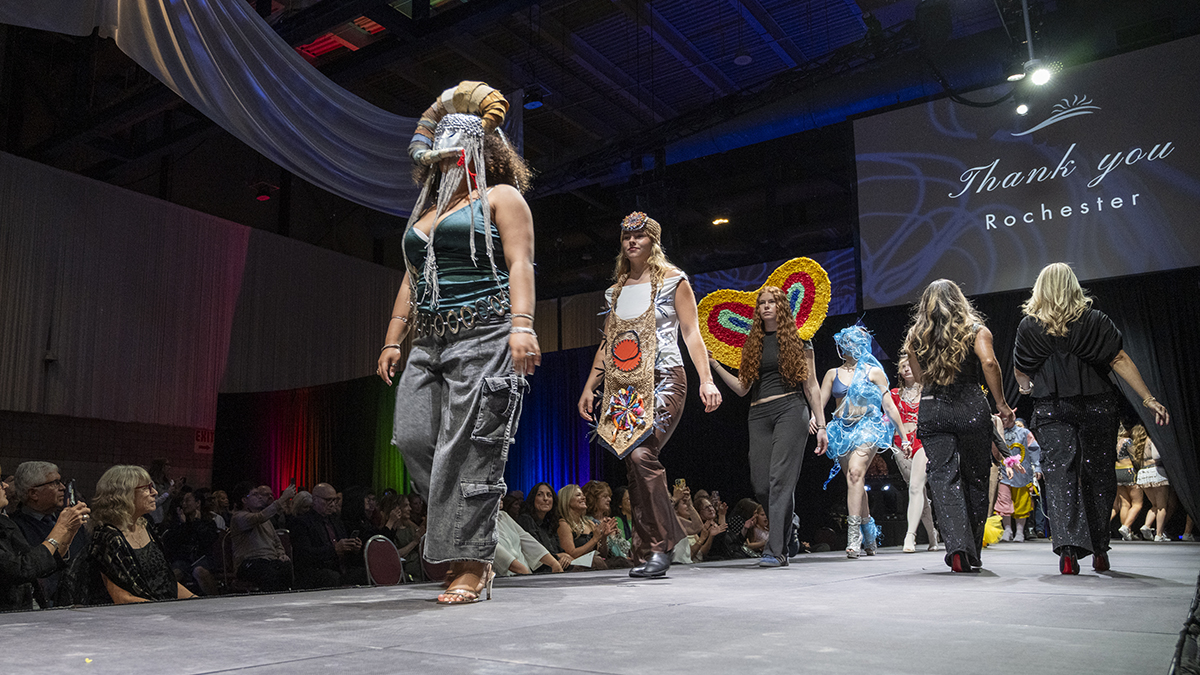 Students showcase Charrette creations on the Rochester Fashion Week runway.