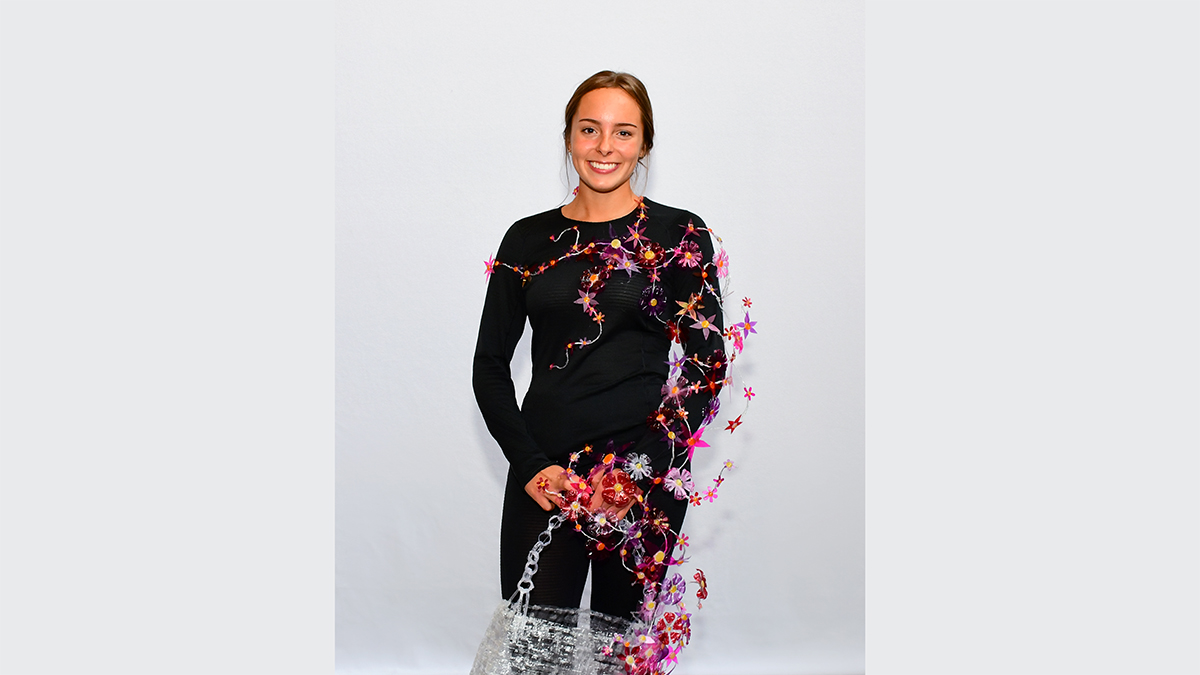 A handbag made of plastic material and floral pattern.