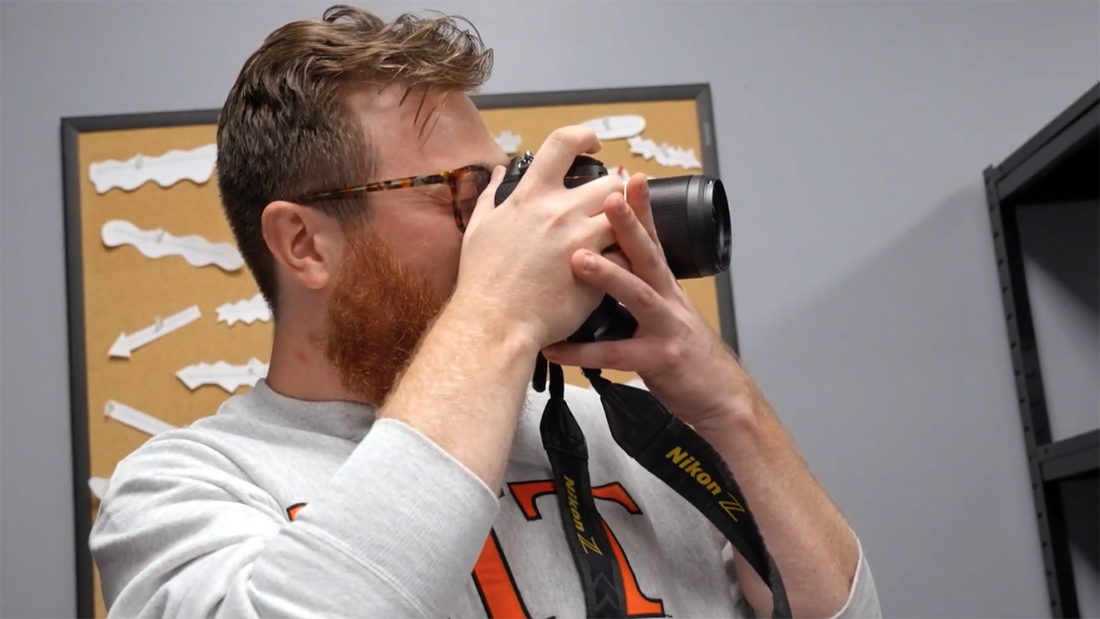 Bobby Gold operating a camera.