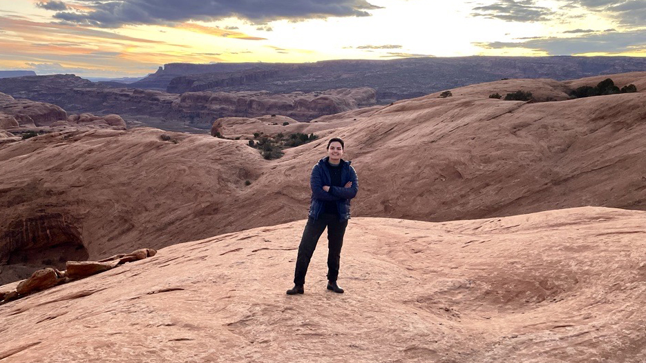 Liz Stublen set against sand dunes.