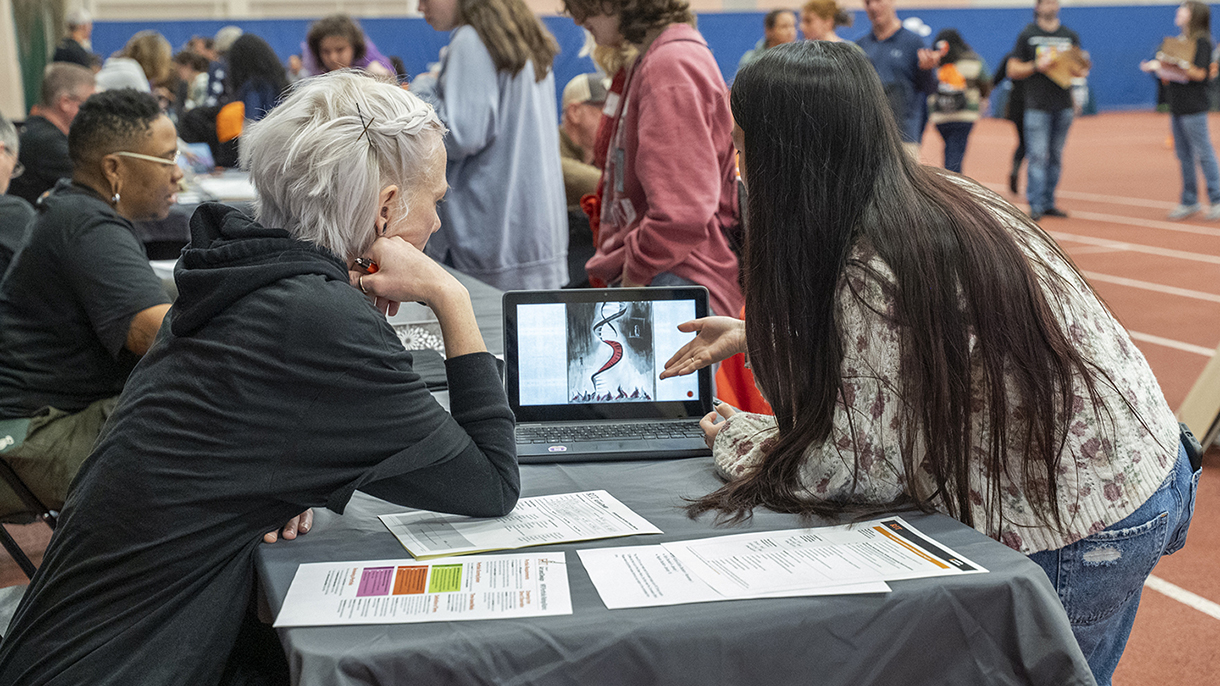 Faculty Laurel Fulton speaks with a student.
