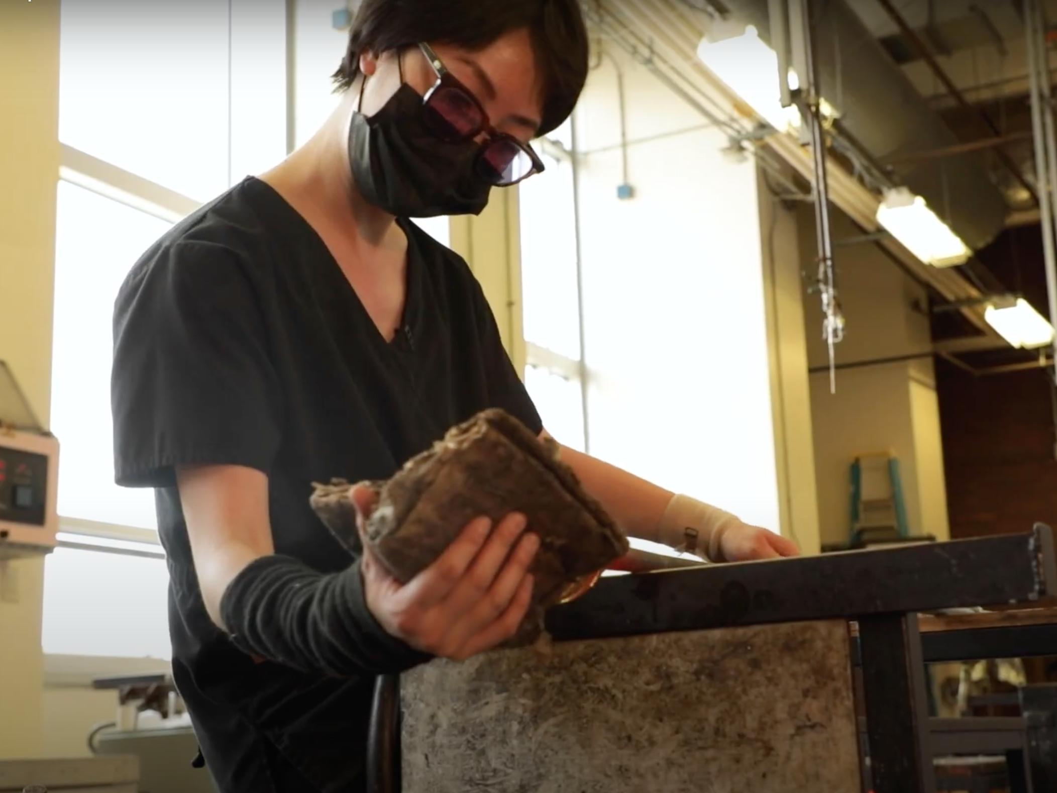 Ying Chiun Lee blows glass in the hot shop.