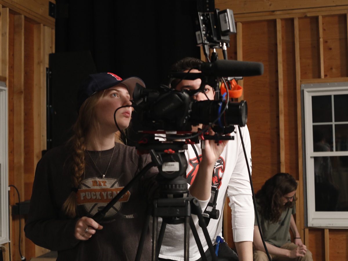Gayle McAdams operates a camera.