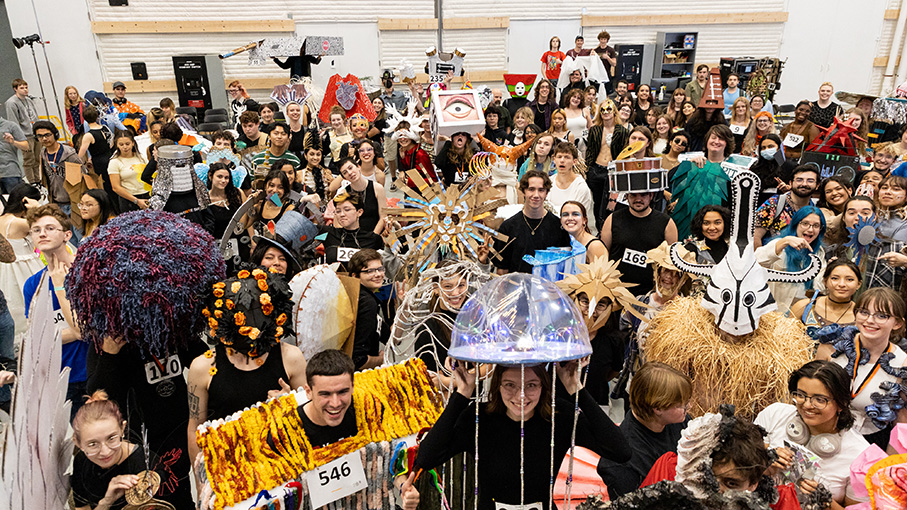 A group of students in wearable sculptures they created for the annual Charrette workshop.