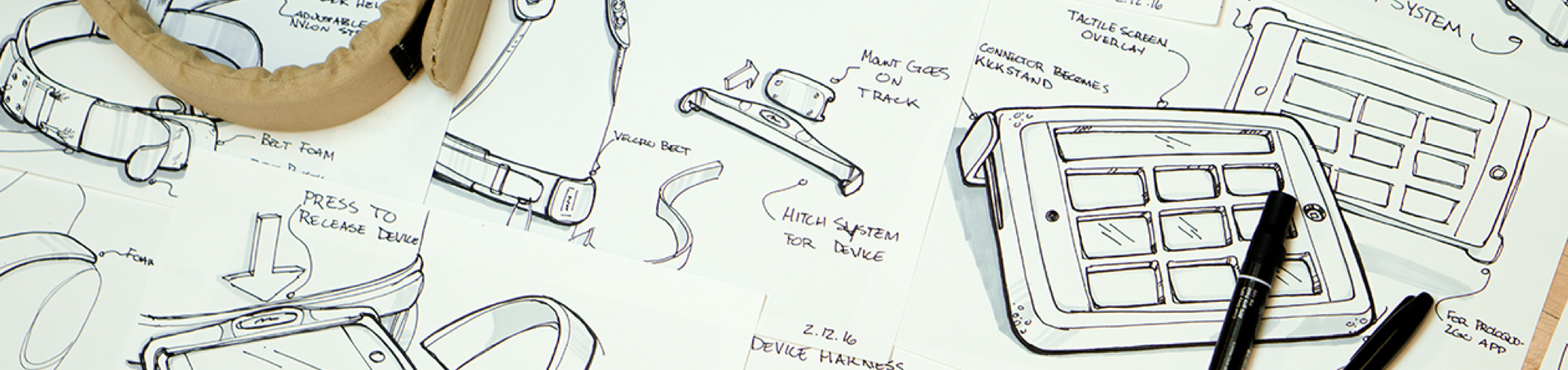 A banner image with sketches on paper