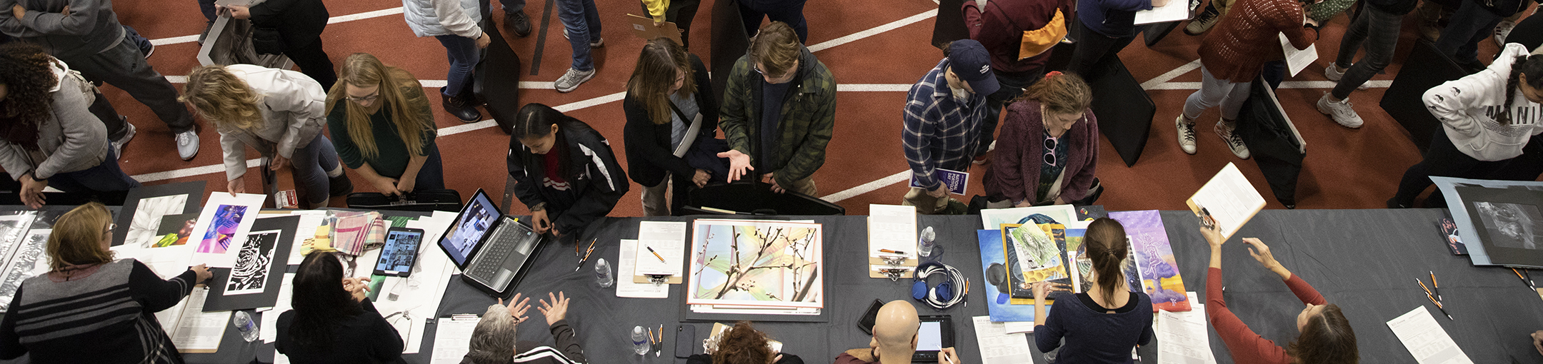 An overhead shot of students receiving portfolio reviews at RIT's 2019 National Portfolio Day.