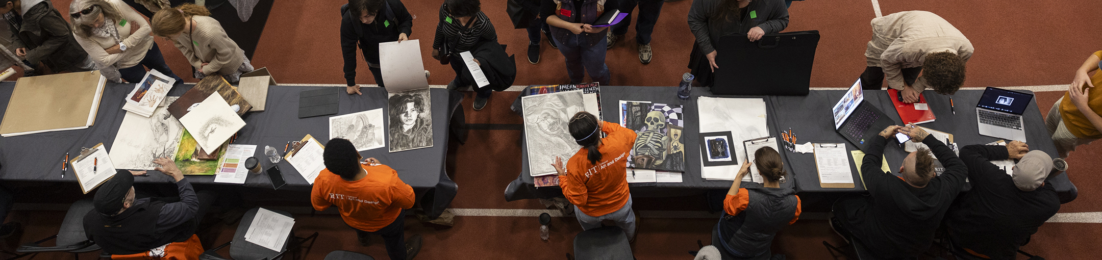 An overhead shot of students receiving portfolio reviews at RIT's 2023 National Portfolio Day.