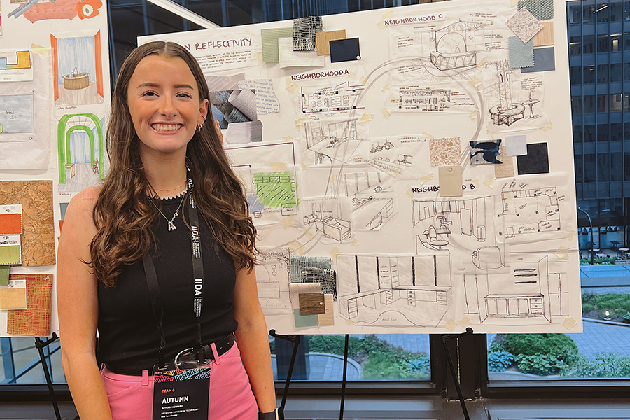 Autumn Howard next to a poster board.