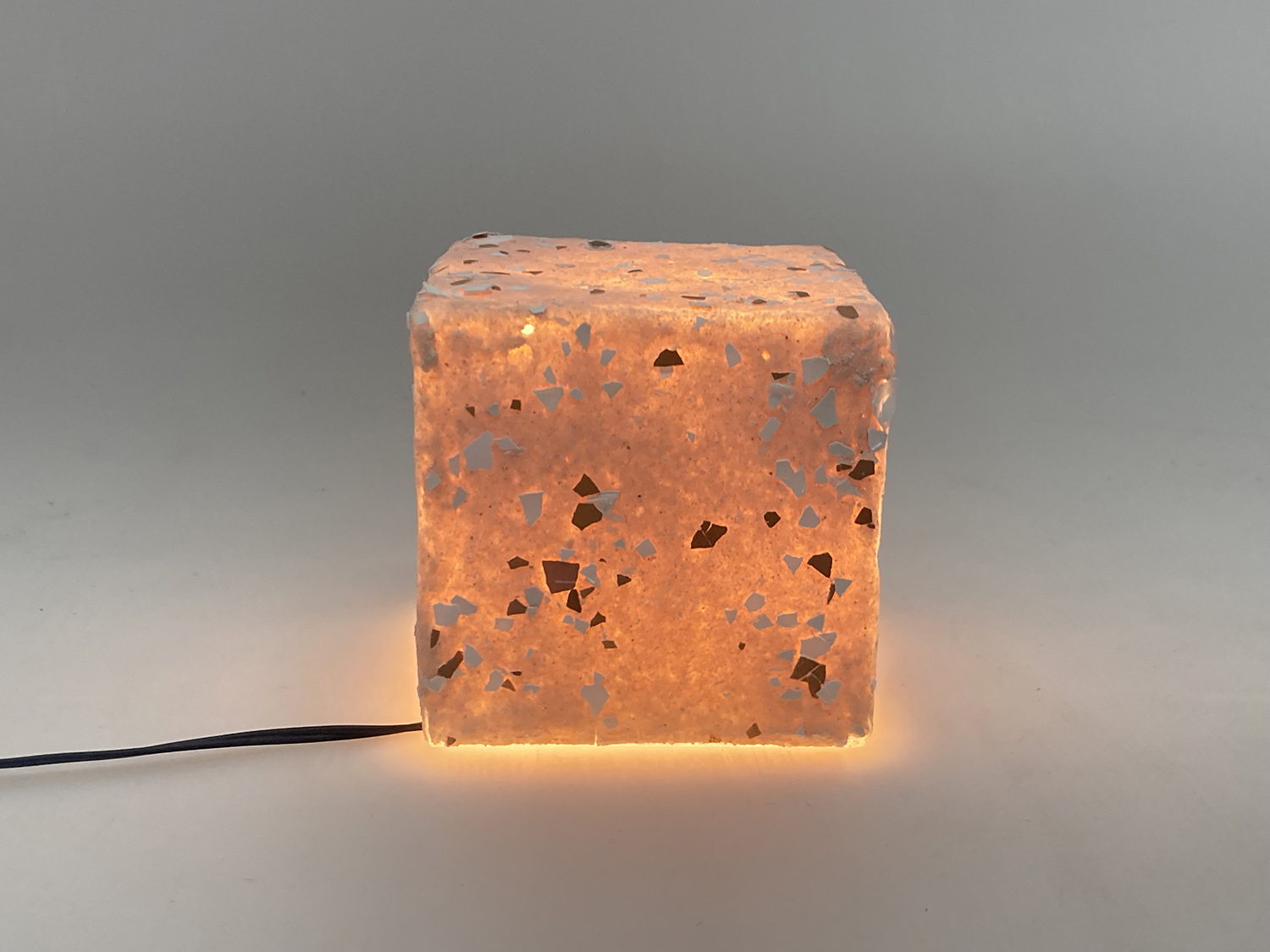 An illuminated lamp that resembles a rock.