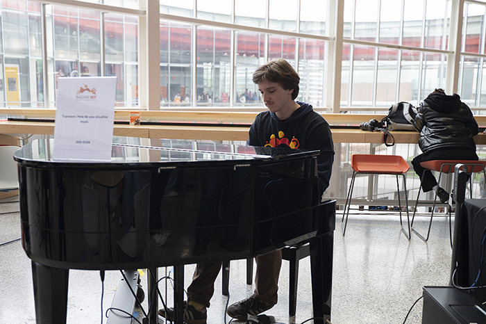Colin O'Brien plays the piano.