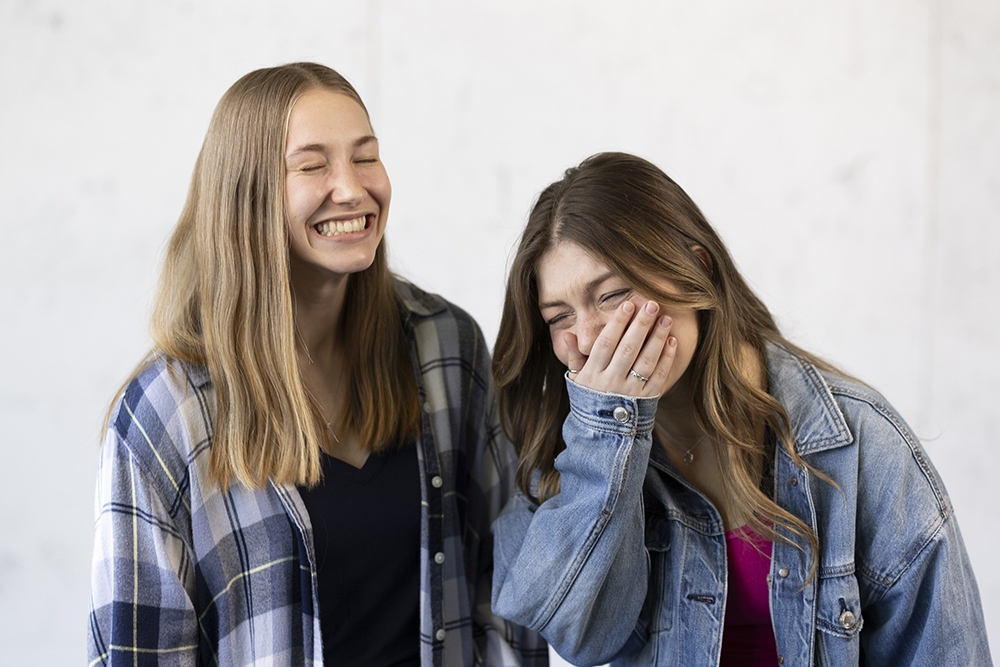 Jackie Drozd and Bari Hayden laugh as they get their portrait taken.