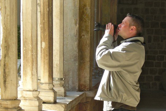 Jack Beck takes a photo with his camera.