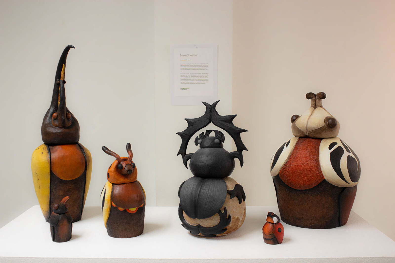 A series of six Egyptian-inspired ceramic jars.