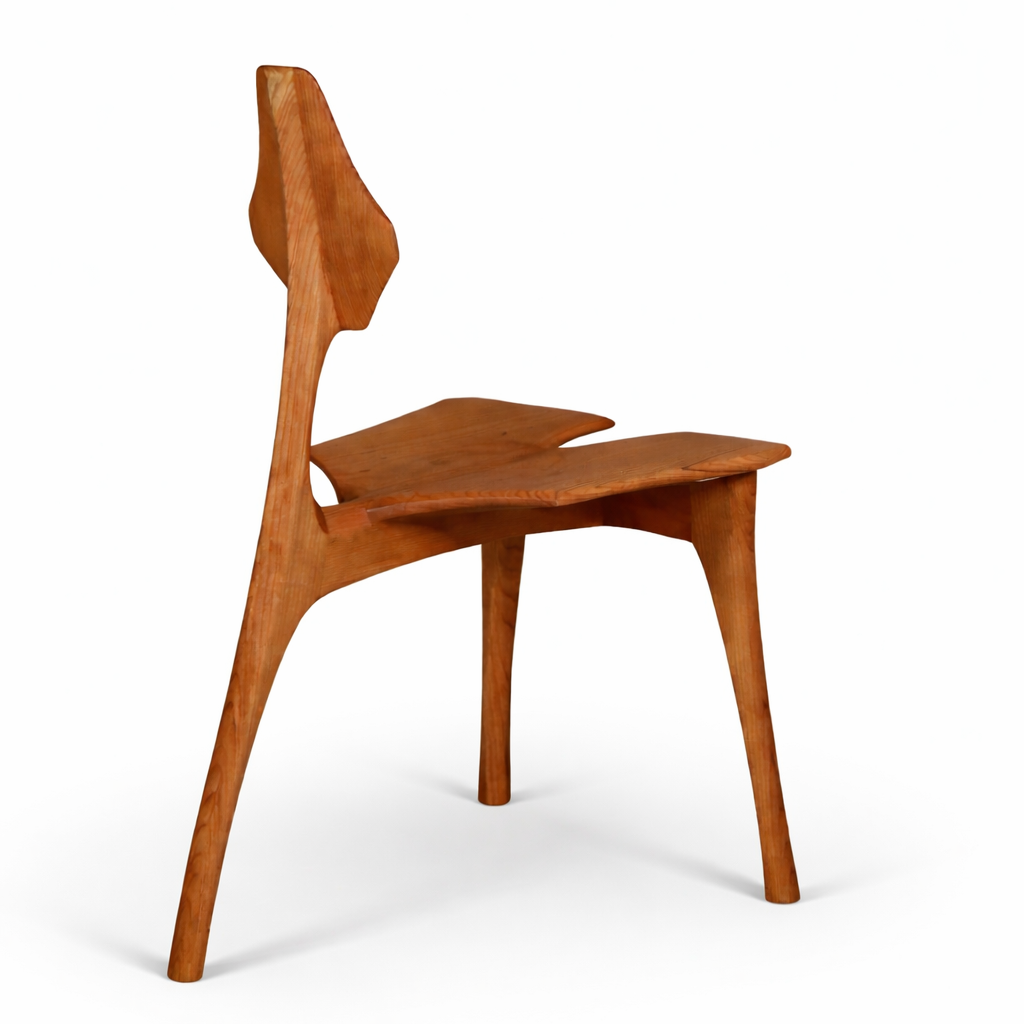 A wooden chair set against a white background.