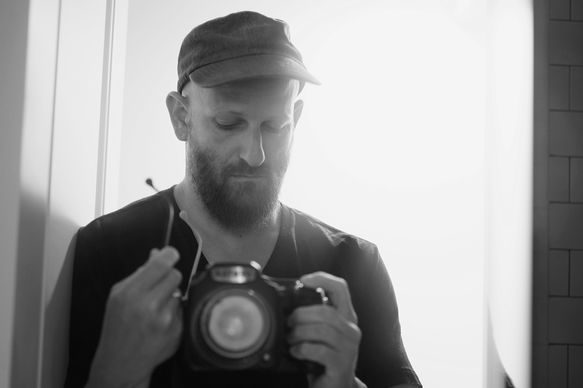 Gregory Halpern takes a photo of himself in the mirror.