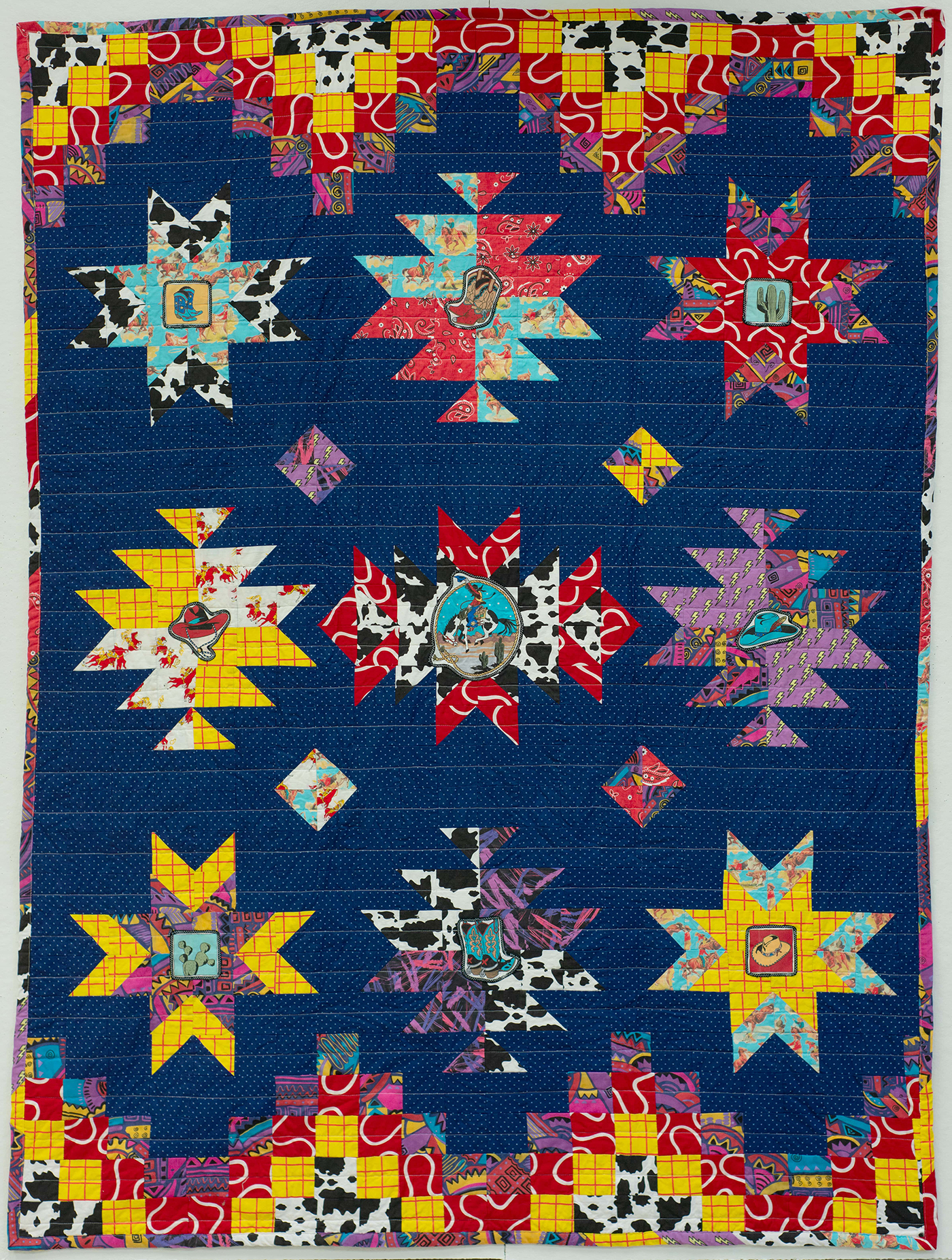 A quilt with interesting, colorful patterns.