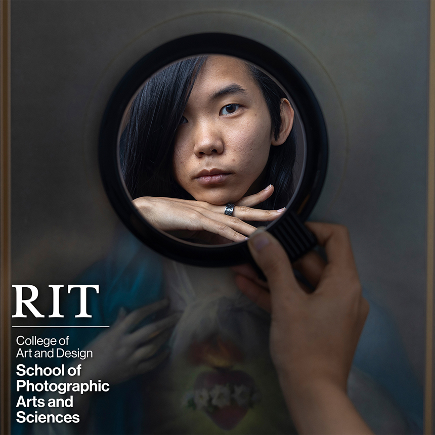 A mirror shows a person's face.