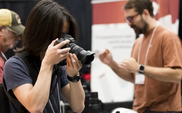 A person take a photo with a camera.
