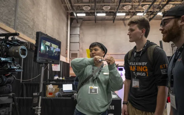 Conference attendees check out high-end camera systems.