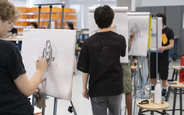 Students make gesture drawings.