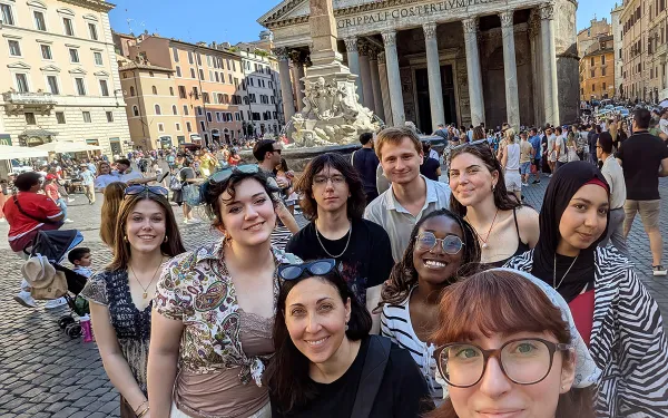 Students and faculty take a group selfie in Italy.