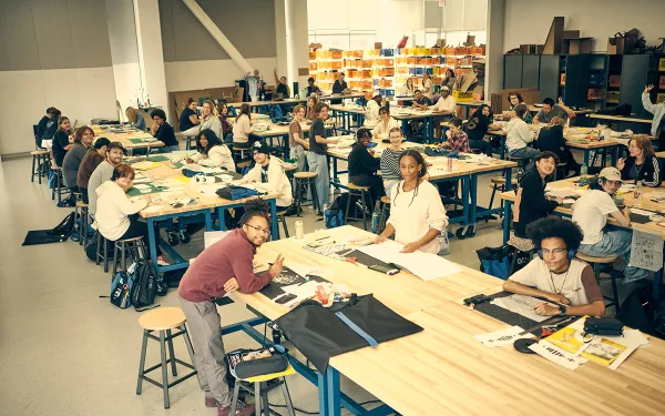 RIT 2D design students work and smile in the SHED classroom space.