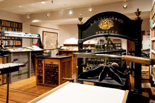 a room with antique printing presses.
