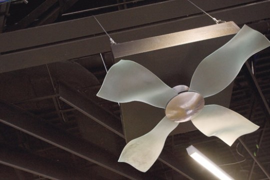 a ceiling fan with wavy arms.