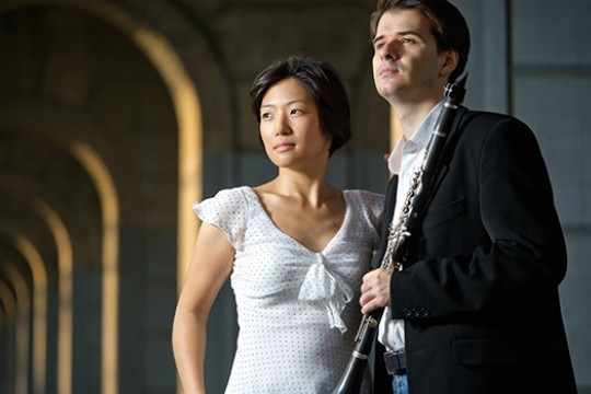 Two musicians posing for camera