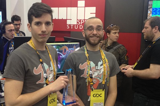 Two people posing for camera at conference