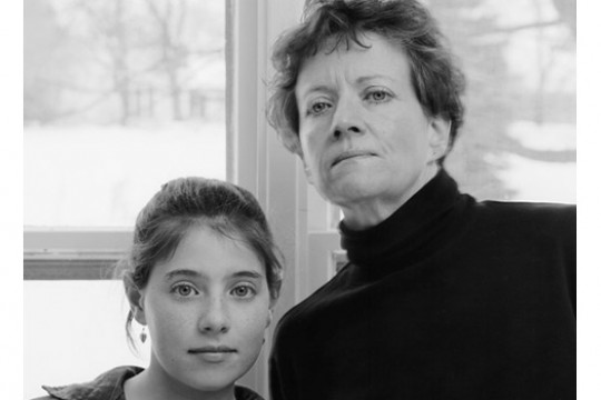 Two people posing in front of camera