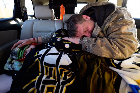 Person sleeping in car