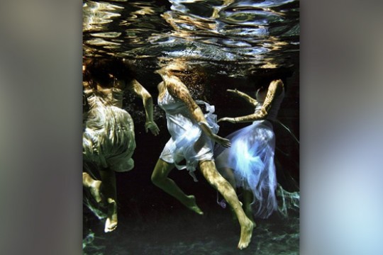 Picture of people in dresses underwater
