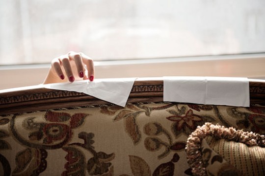 Picture of hand near couch
