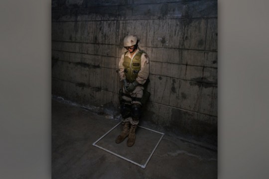 Uniformed person under the spotlight 